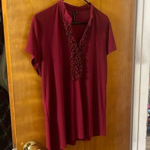 This short sleeved blouse looks great under a jacket or sweater. It is used.